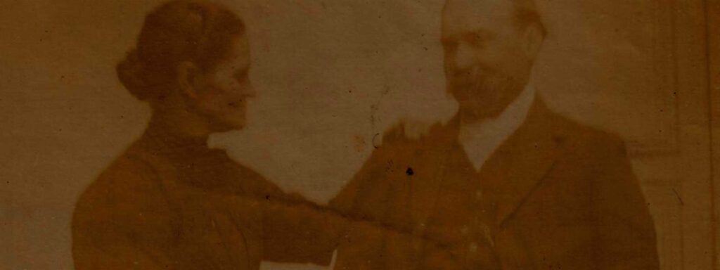 1800's daguerreotype of a woman looking at a man and putting her hand in his shoulder